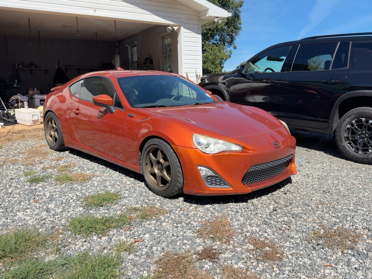 Stephen Teems’s real Hot Lava Scion FR-S outside his garage